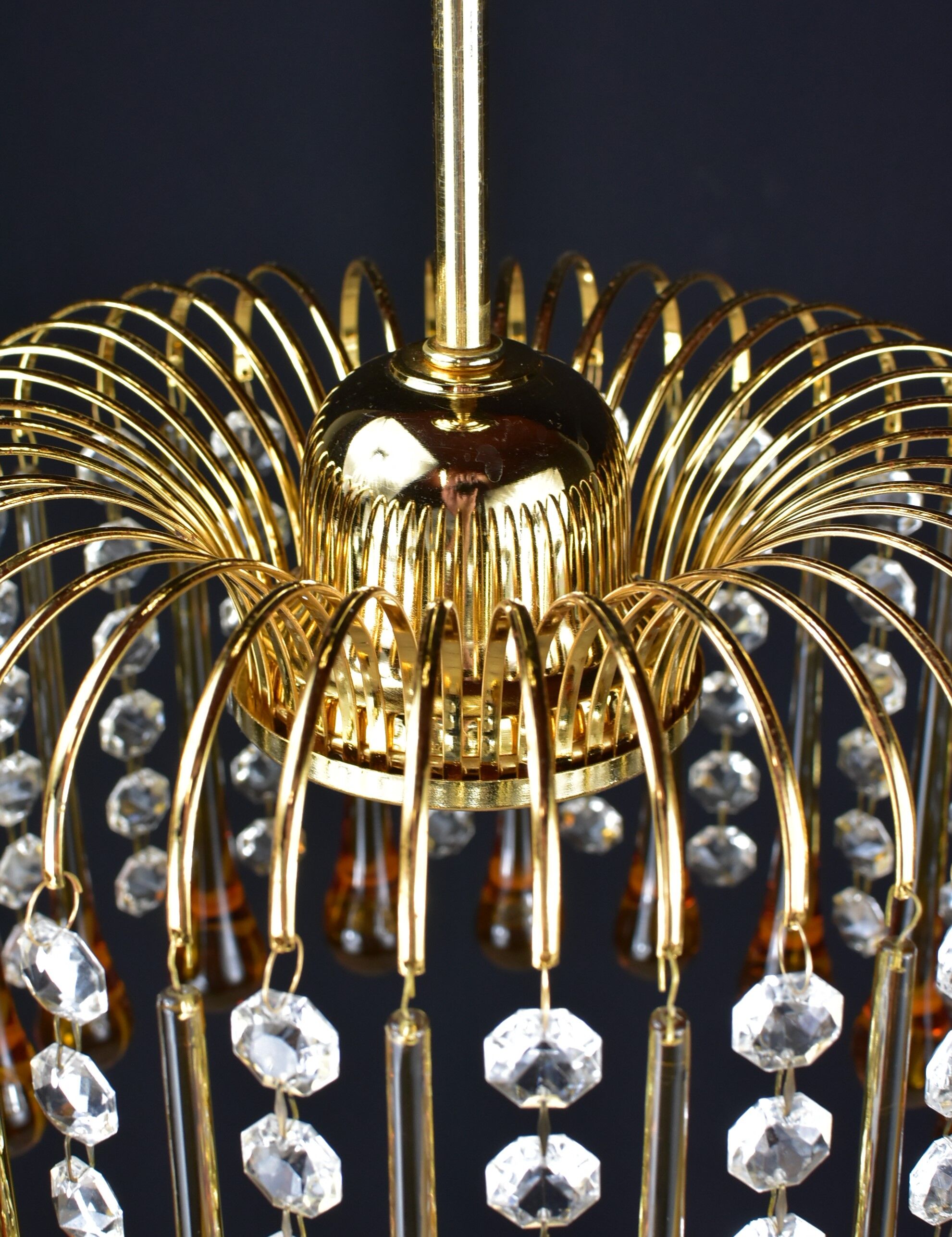 Suspension with tassels drops of water an glass