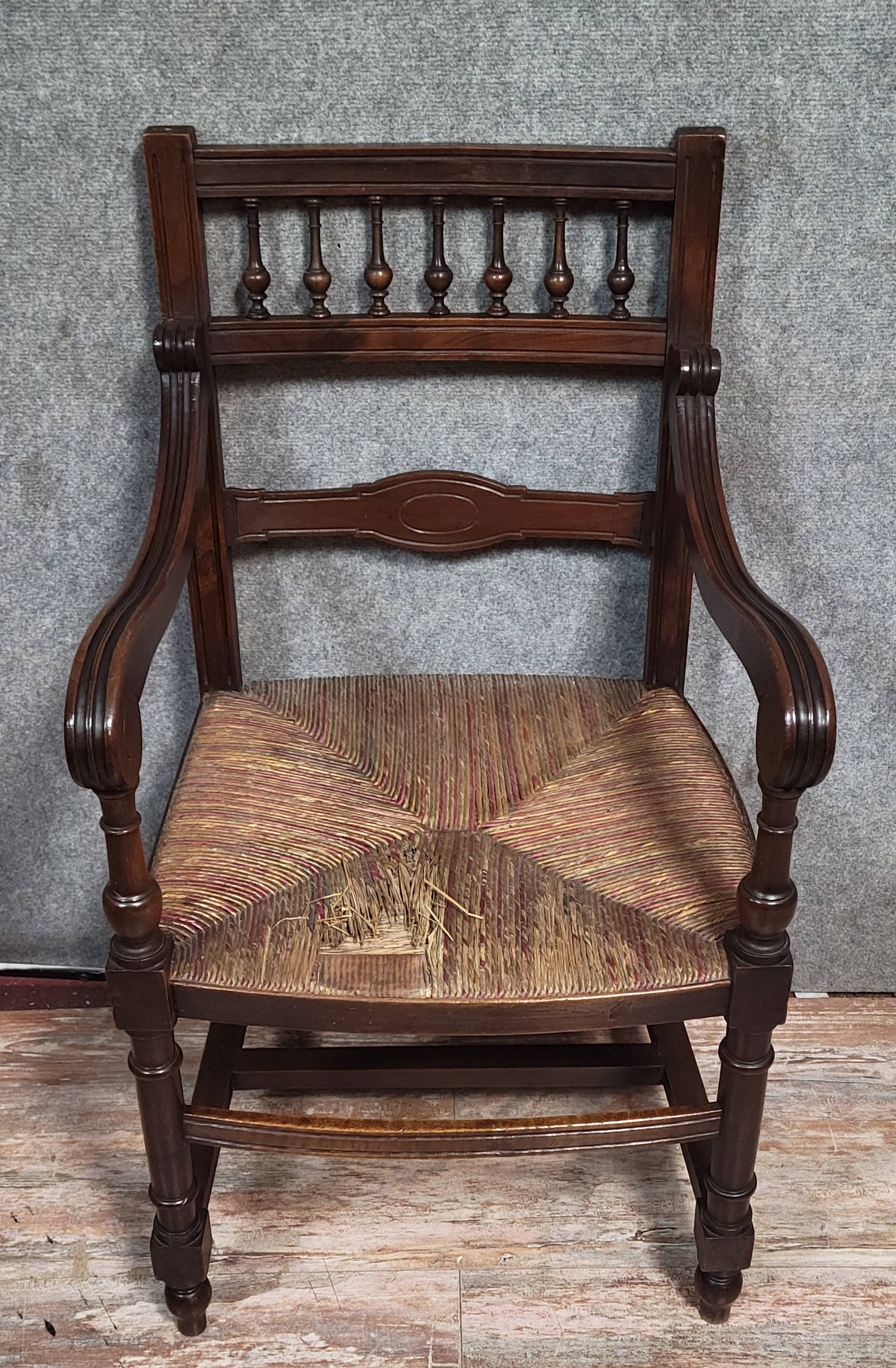 Renaissance-style armchair in solid wood, featuring a columned back