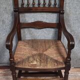 Renaissance-style armchair in solid wood, featuring a columned back