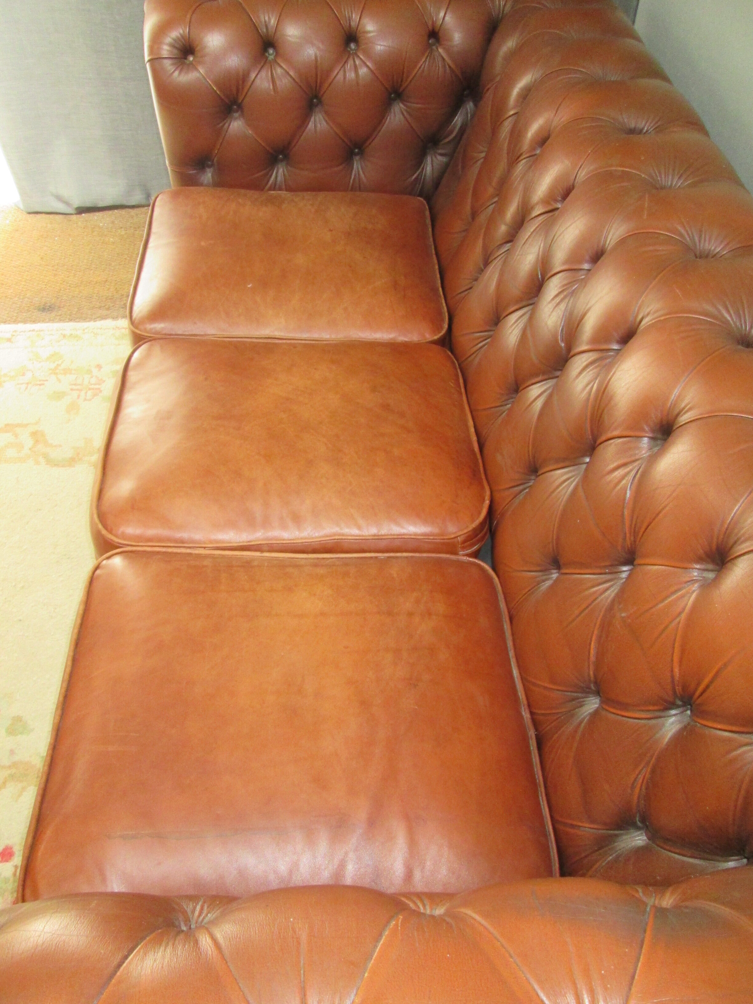 Brown leather chesterfield sofa