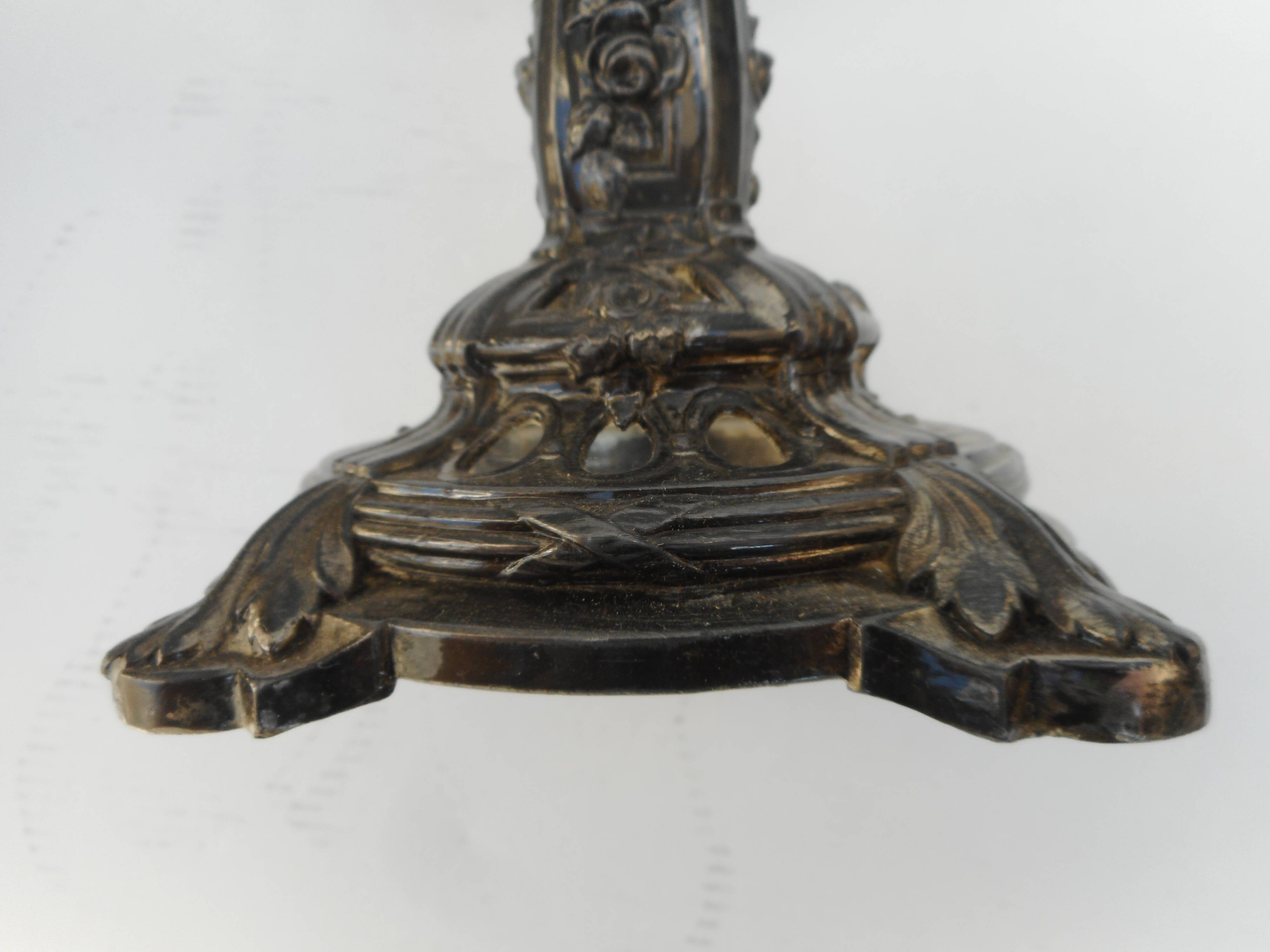 A glass cup on metal stand