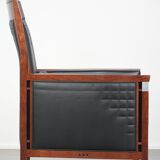 Art Deco design armchair with black leather with decorative stitching