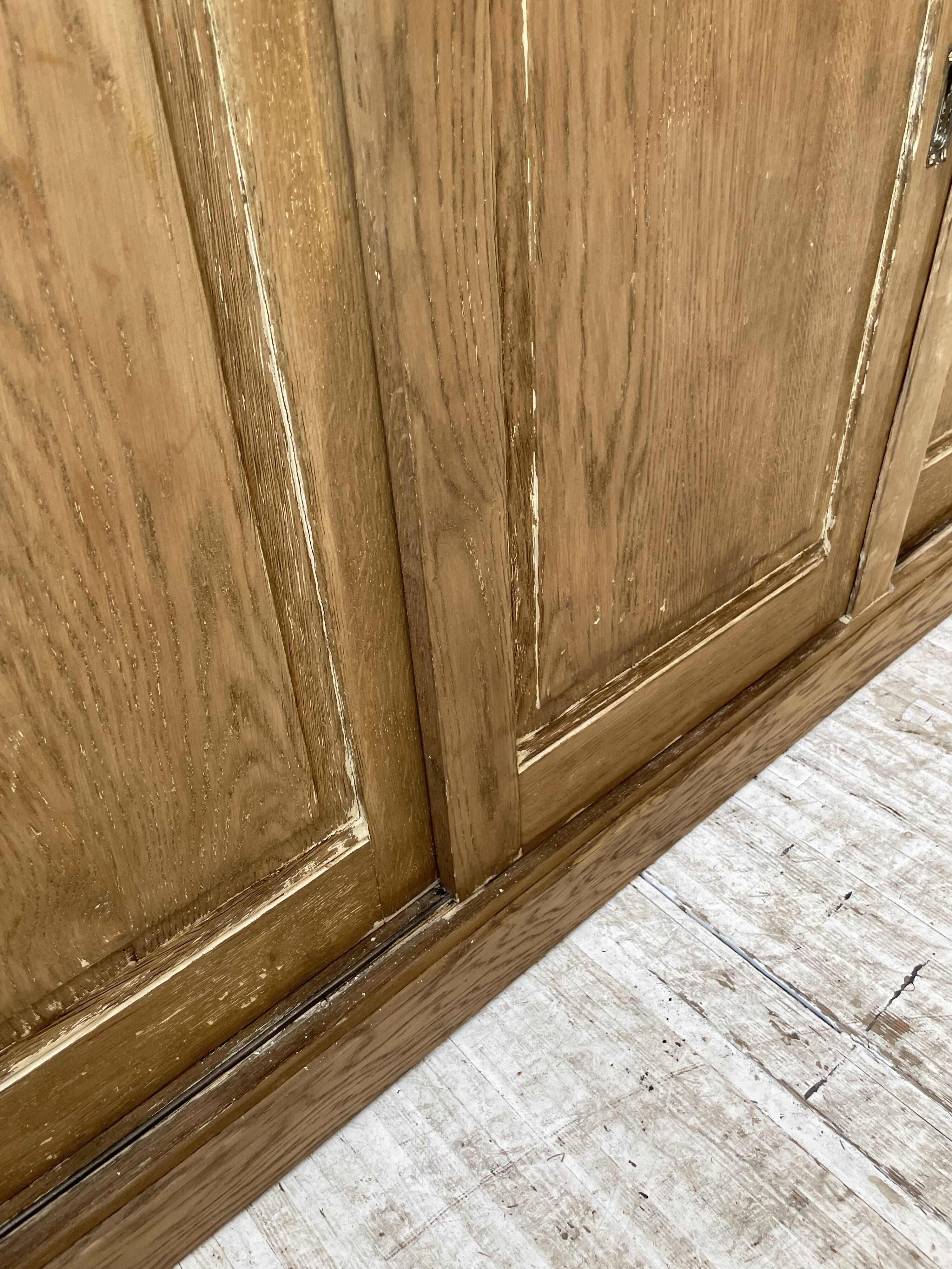 Large row of solid oak loom sliding doors