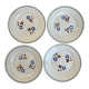 Set of 4 small flat plates with floral designs.