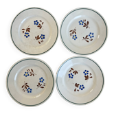 Set of 4 small flat plates with floral designs.