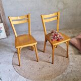 Old and pretty pair of Baumann bistro chairs
