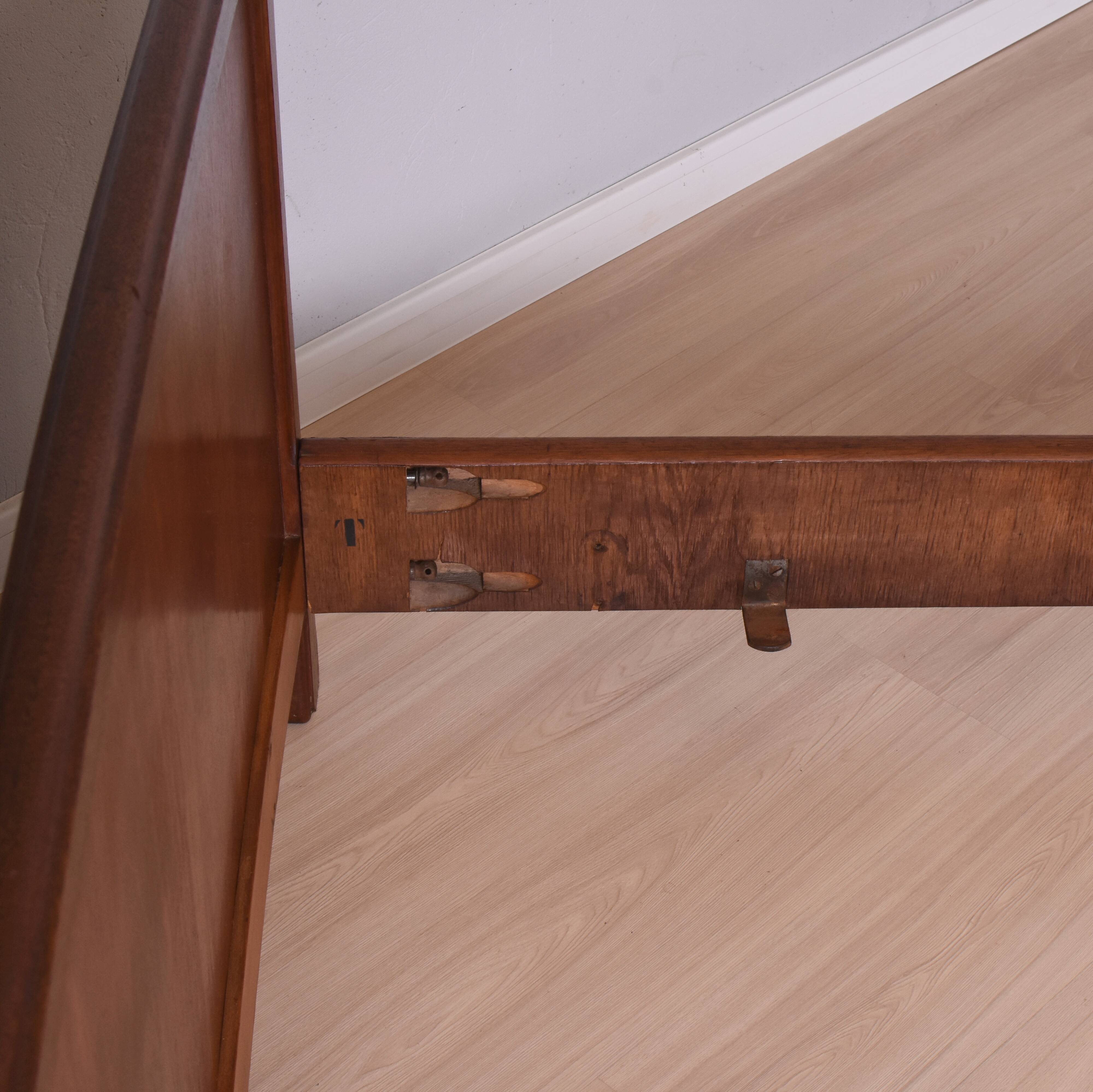 Wooden bed, early 20th century.