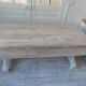 Console table in walnut with drop-leaf extensions, grey patinated base.