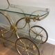 Neo classical style table in silver and gold metal and glass