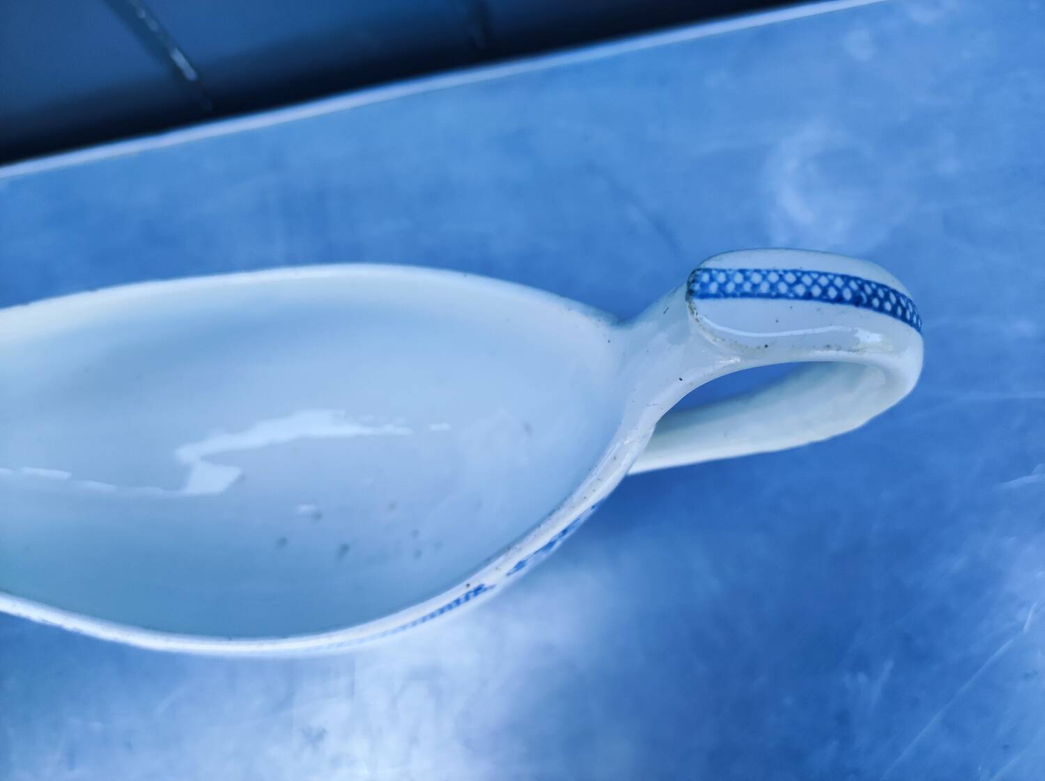 Old earthenware sauce boat