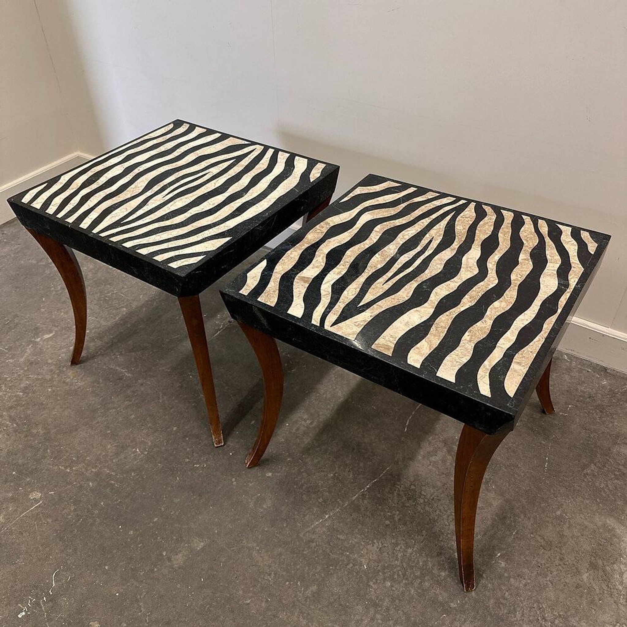 Striking pair of Italian zebra inlaid tessellated stone tables with refined curves