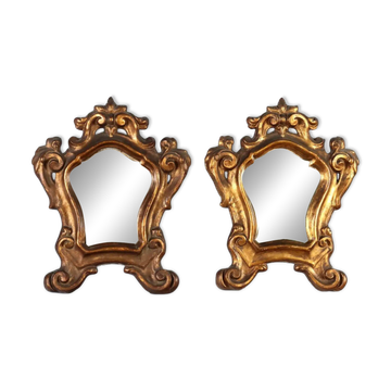 Pair of antique baroque mirrors in carved and gilded wood, Italy, 18th century.