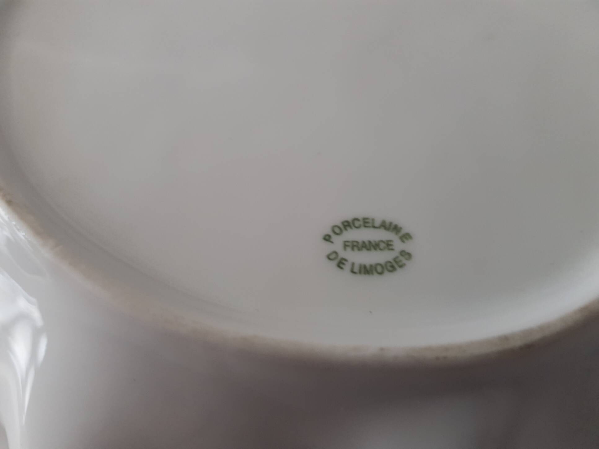 Porcelain vide poche from Limoges with orange decoration.