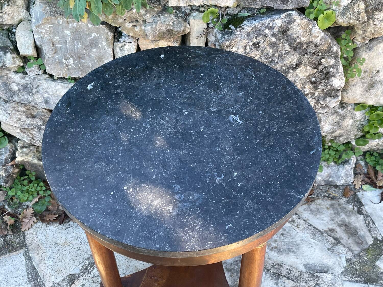 Empire style mahogany and mahogany veneer tripod pedestal table