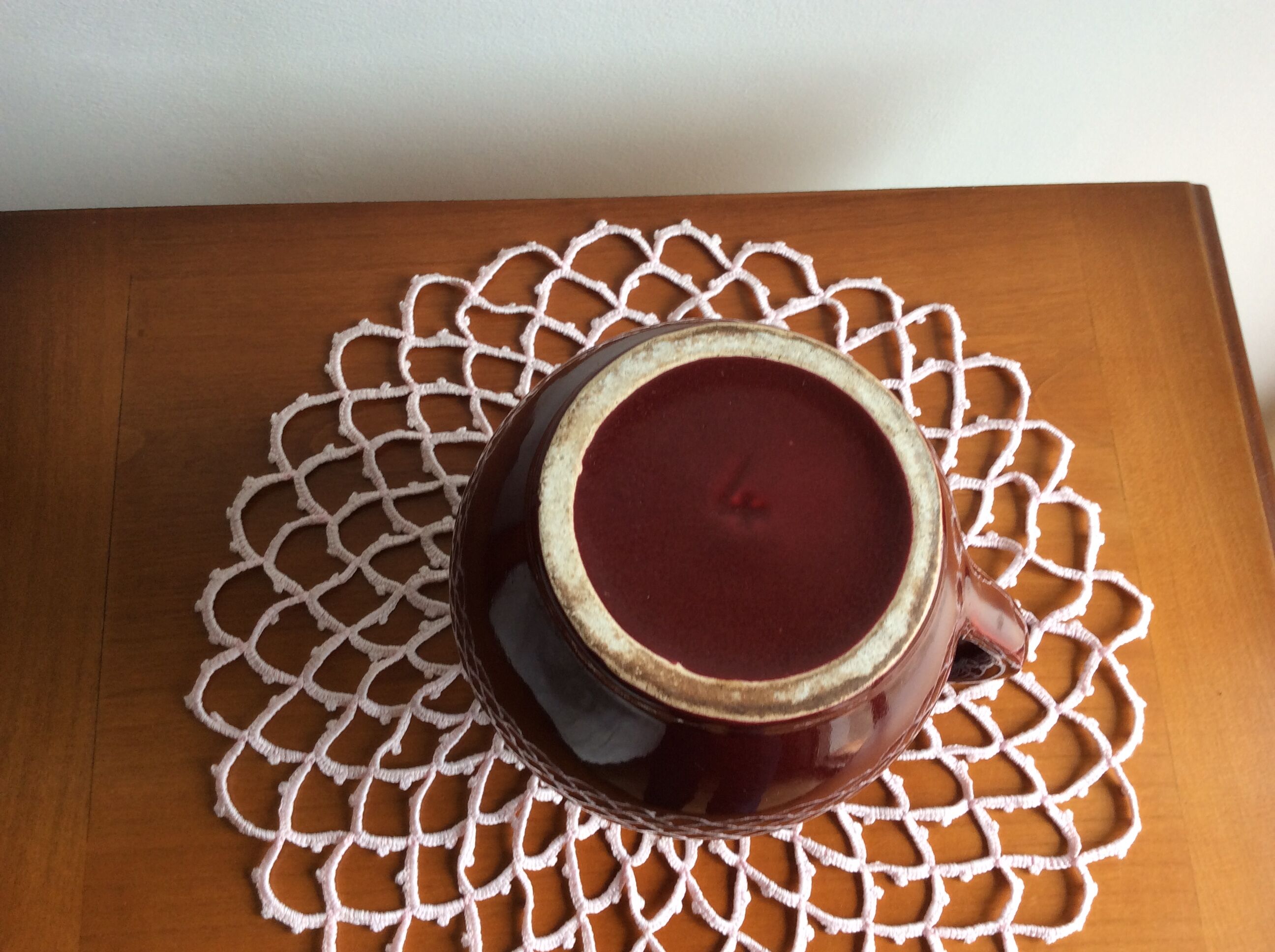 Old dark red ceramic pitcher jug