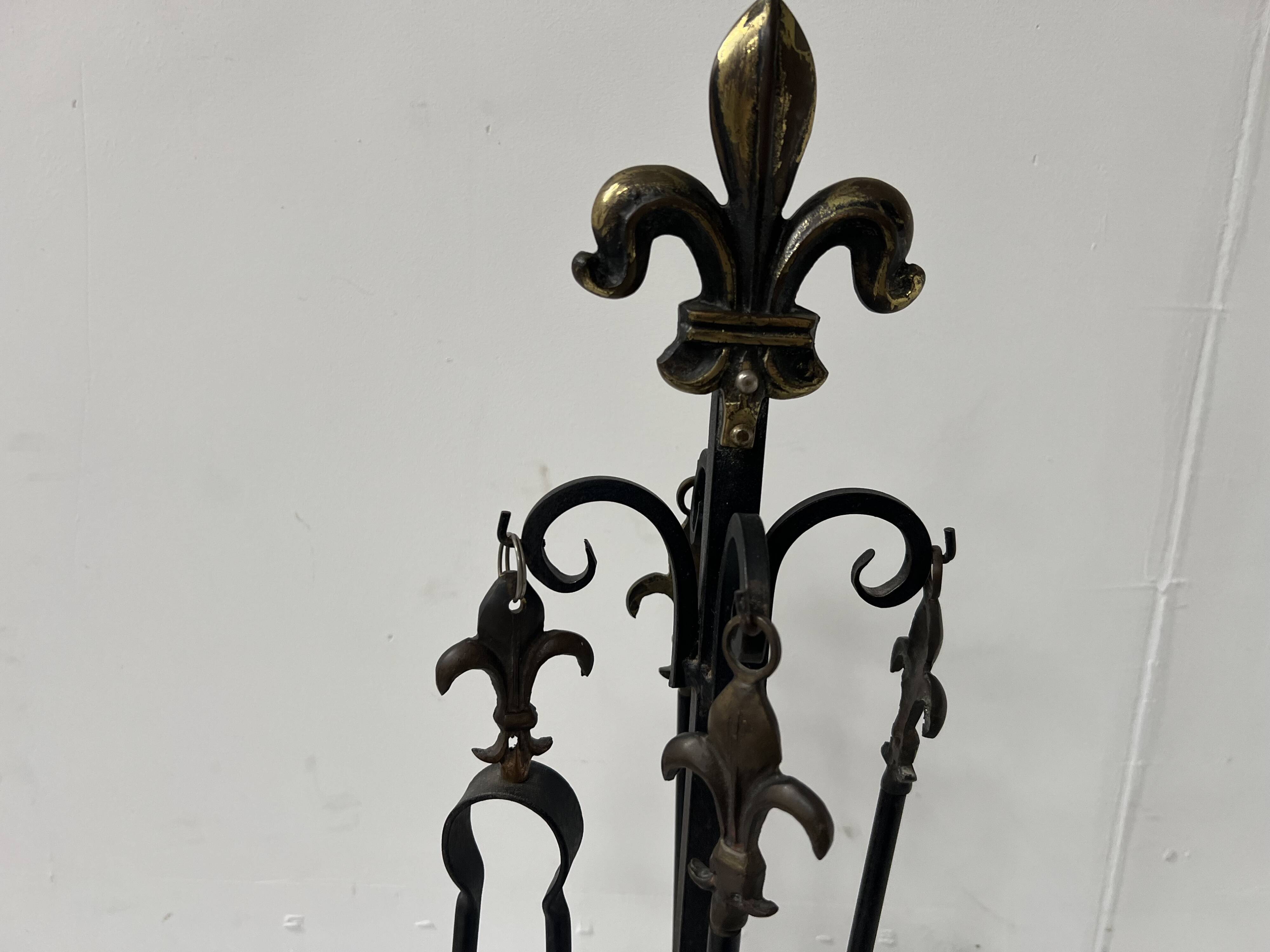 20th century wrought iron and bronze fireplace set