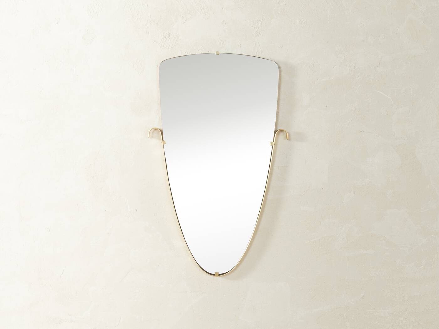 Elegant wall mirror from the 1950s with brass frame
