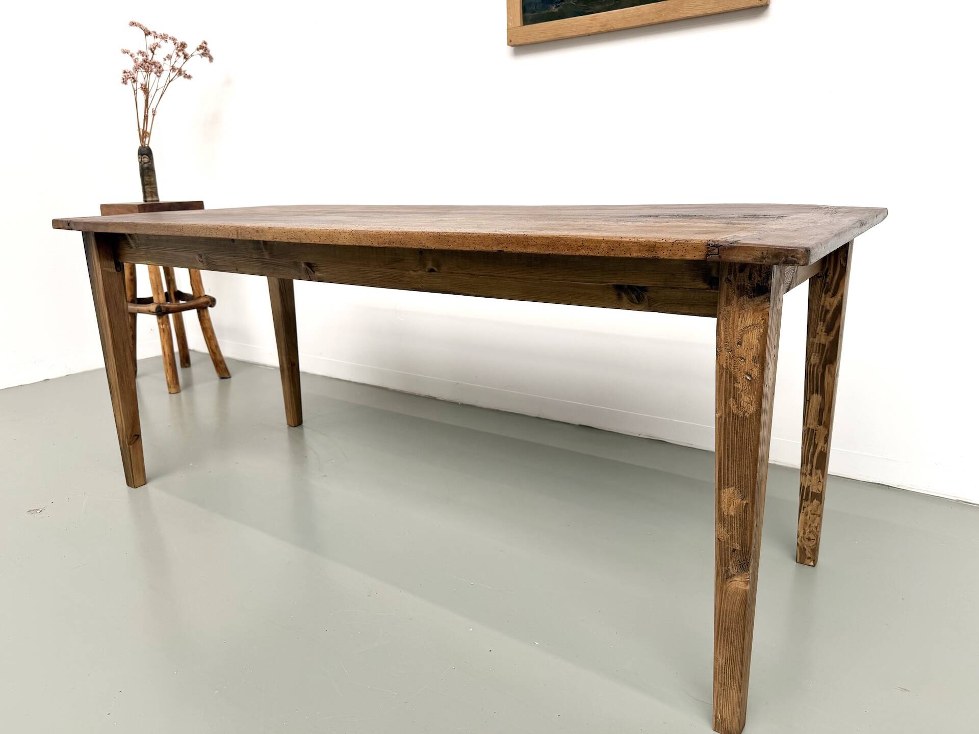 Farm table in walnut with spindle legs.