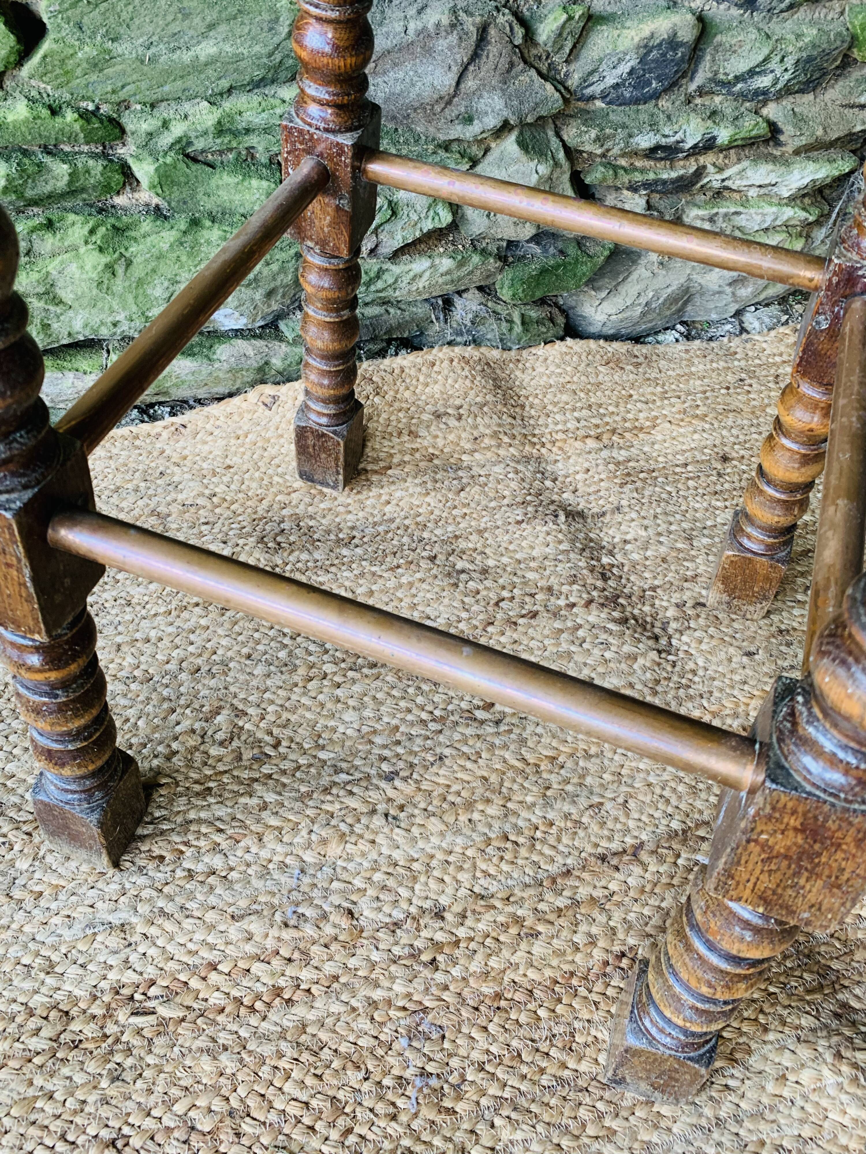 High stool in turned wood