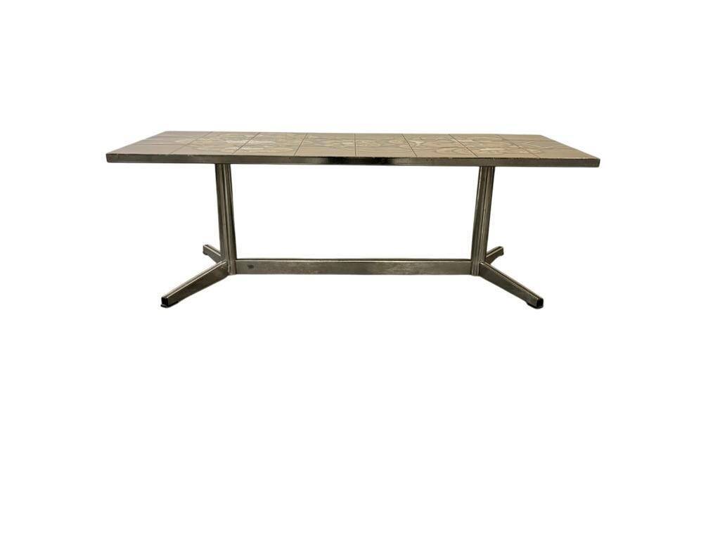 Vintage ceramic coffee table with a chrome frame.