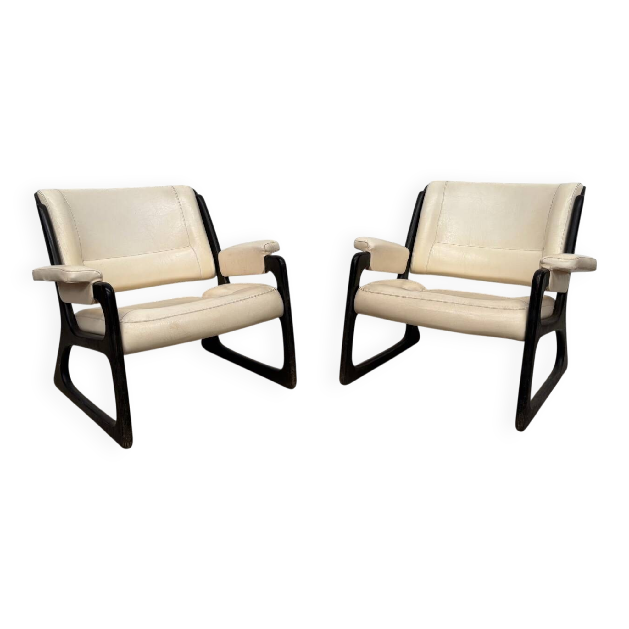Set of two Baumann sled lounge chairs.