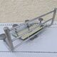 Vintage train style wall-mounted hat rack with angled mirror.
