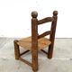 Brutalist chair in wood and straw