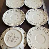 White saucer with raised inlaid pattern