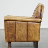 Unique children’s armchair made of cowhide leather in Art Deco style, featuring a light cognac color