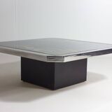 Unique regency coffee table in chrome and brass.