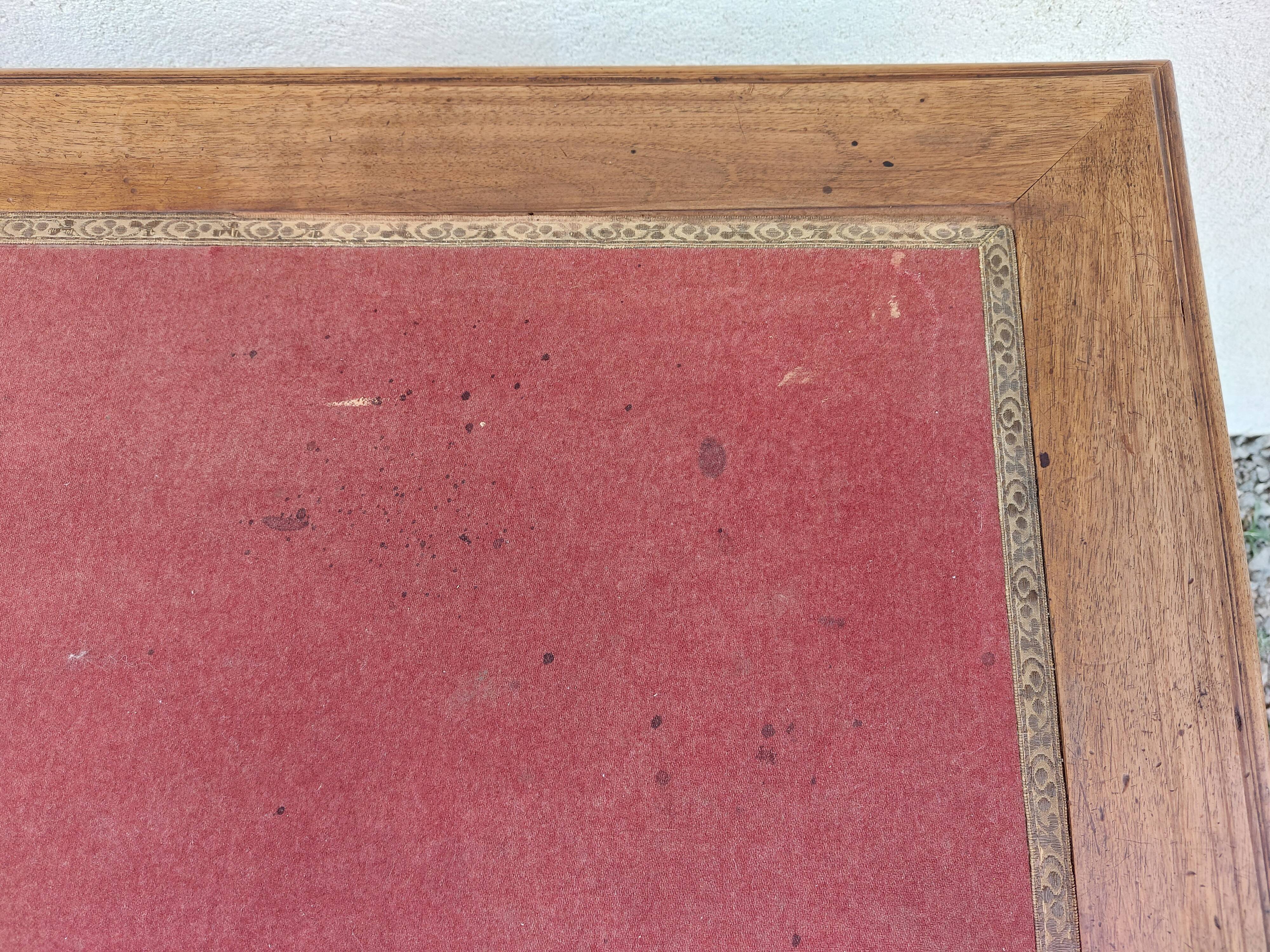 Old wooden desk, red felt top