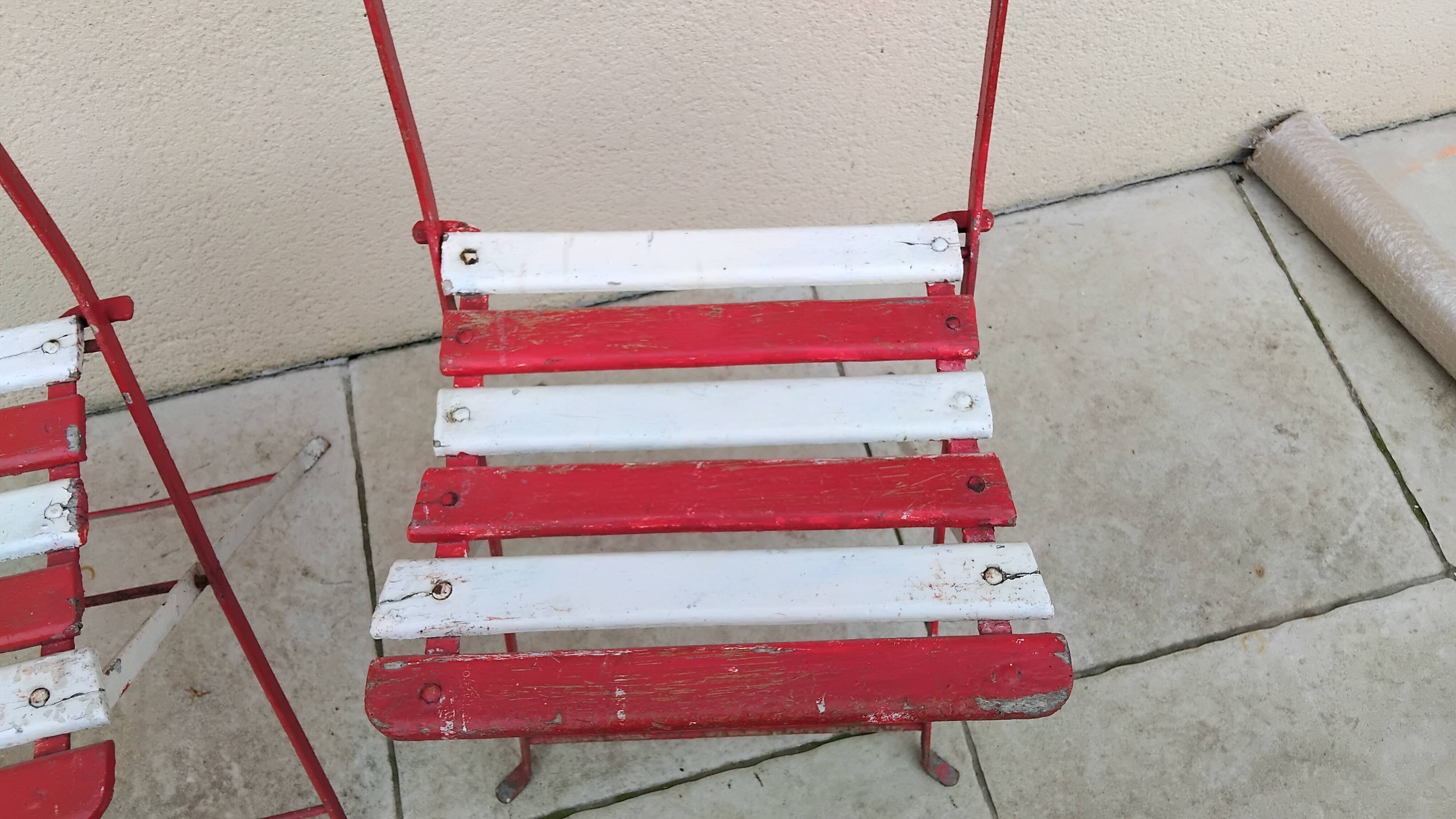 Pair of antique 1900s folding garden bistro chairs