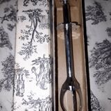 Old sugar tongs with original box.