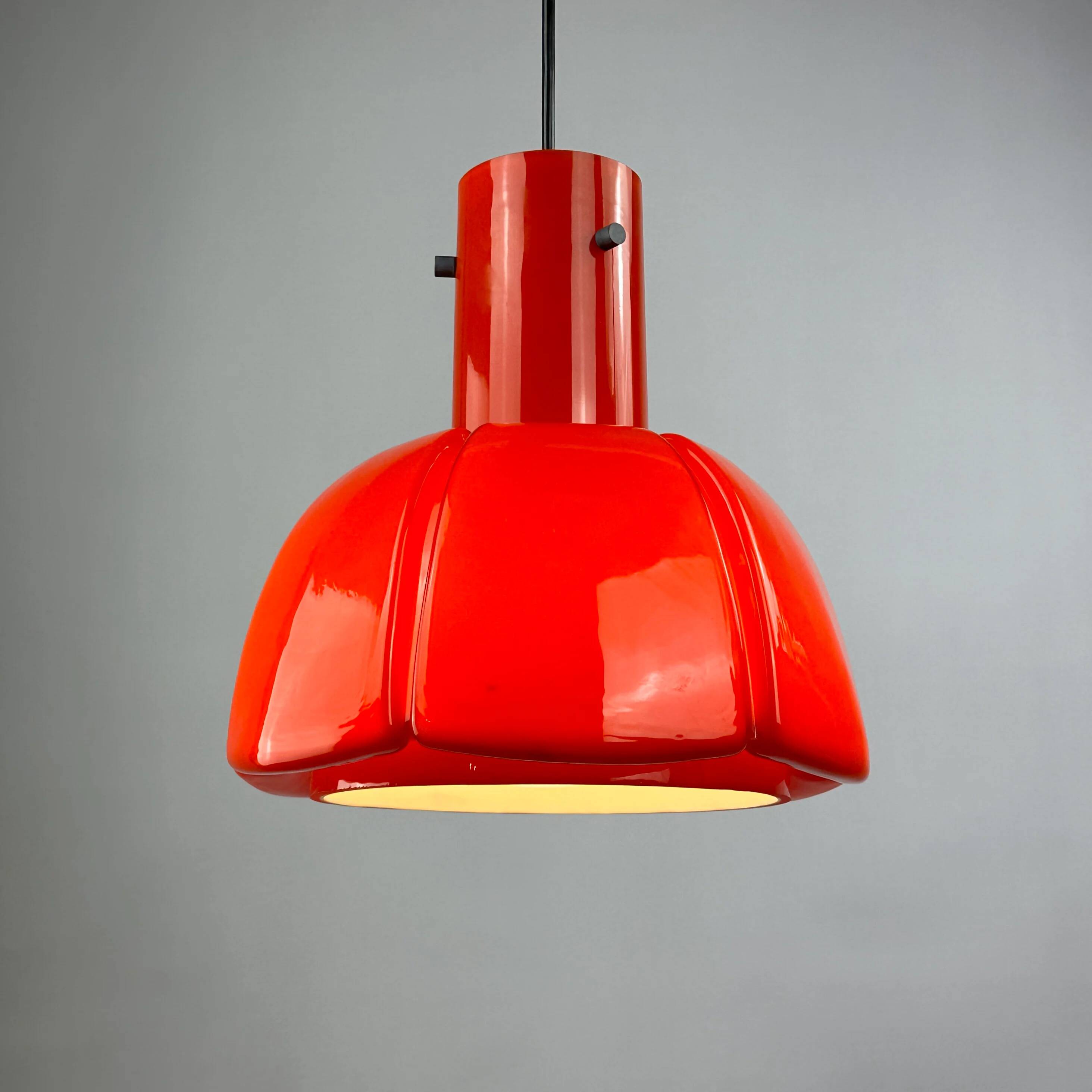 Red glass flower-shaped pendant by Glashütte Limburg.