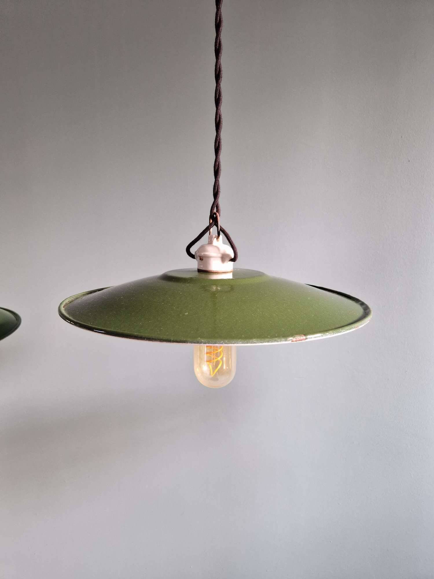 Trio of large industrial suspensions in green enamelled sheet metal.