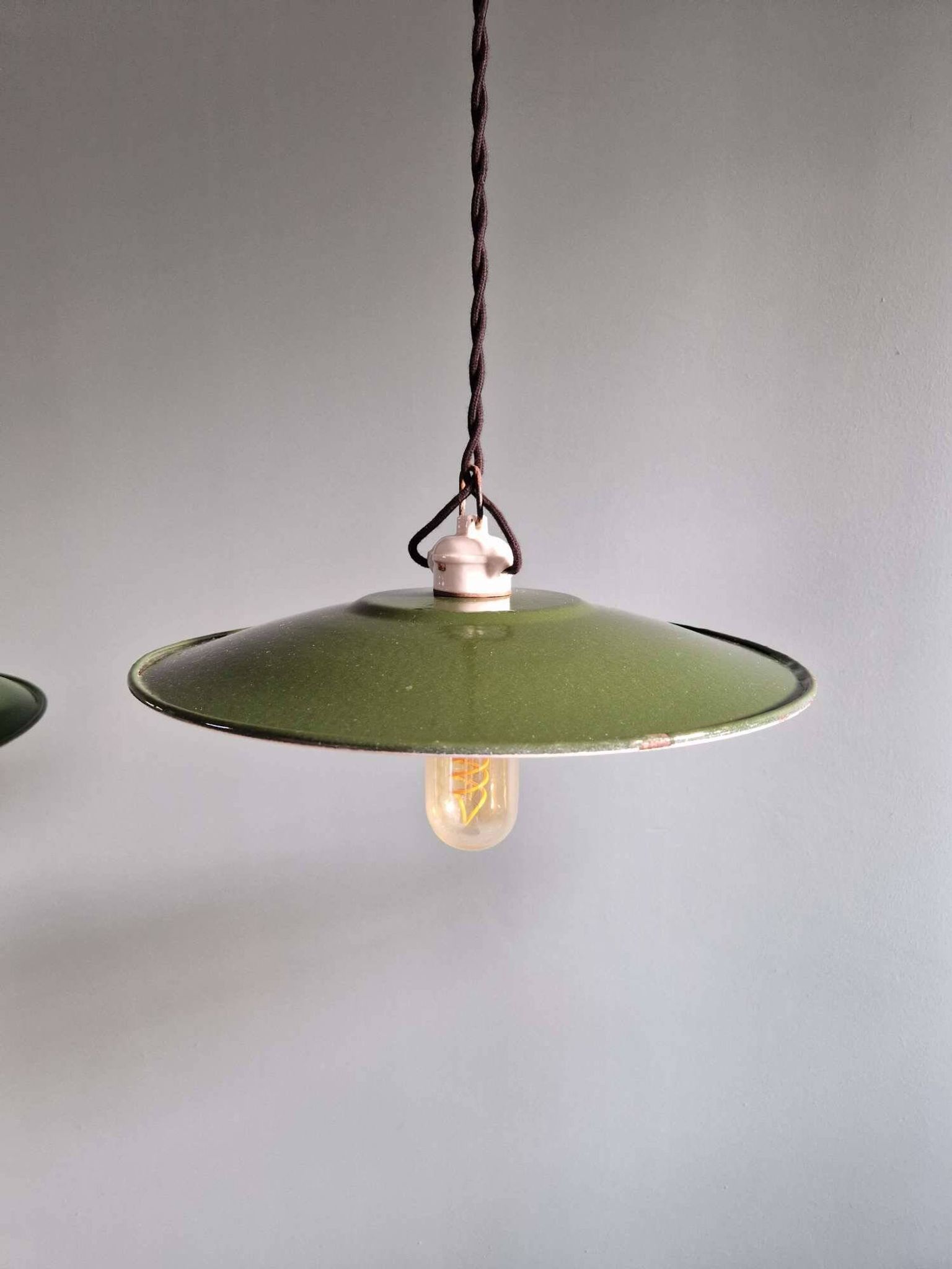 Trio of large industrial suspensions in green enamelled sheet metal.
