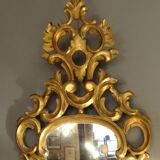 Carved and gilded wooden mirror with gold leaf 46 x 103 cm