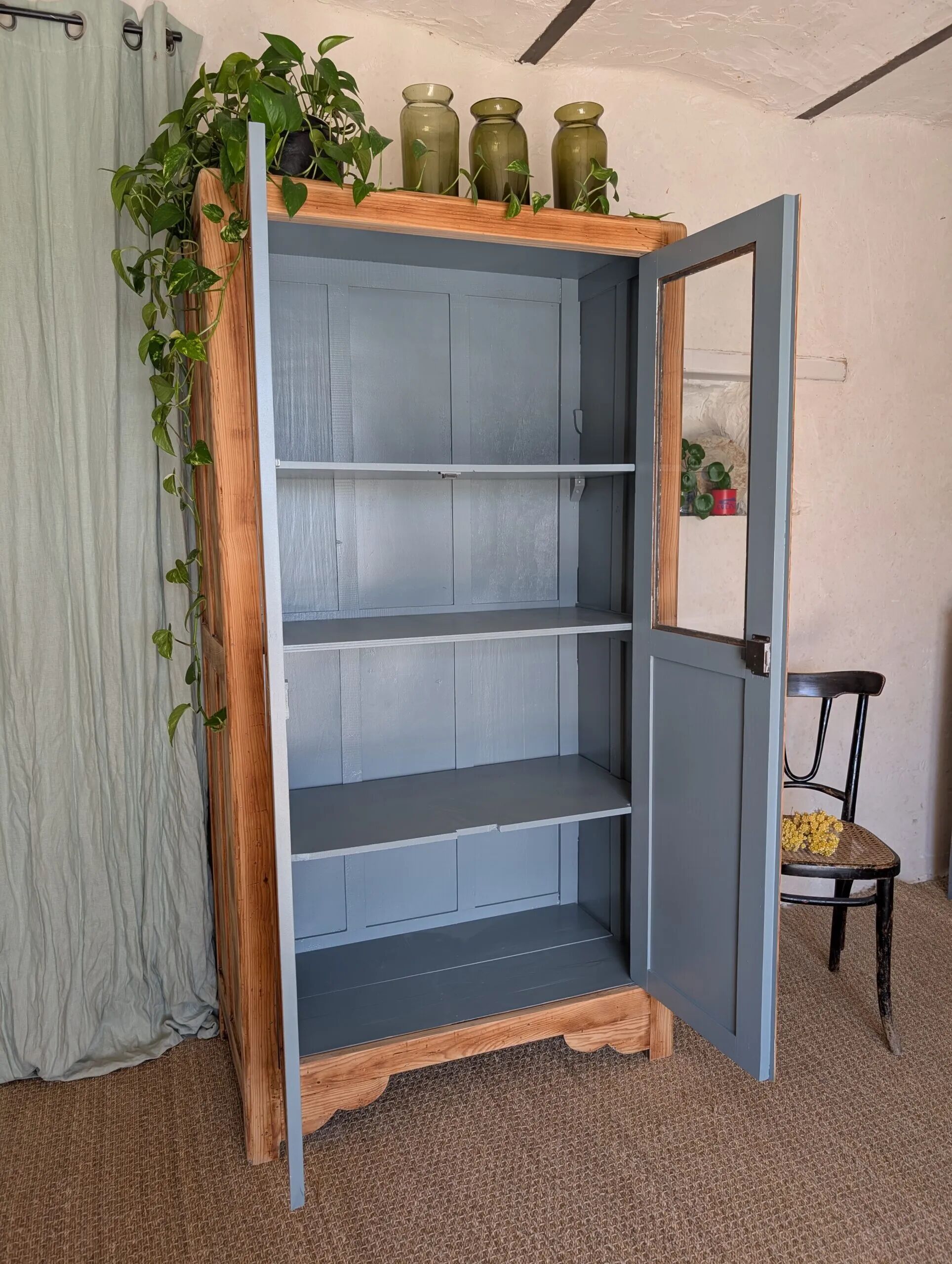 Old glass-fronted wooden library – blue interior