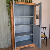 Old glass-fronted wooden library – blue interior
