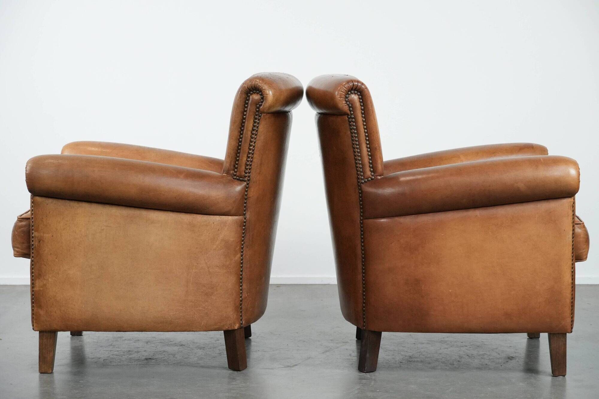 Set of two vintage sheepskin armchairs with beautiful and warm colours