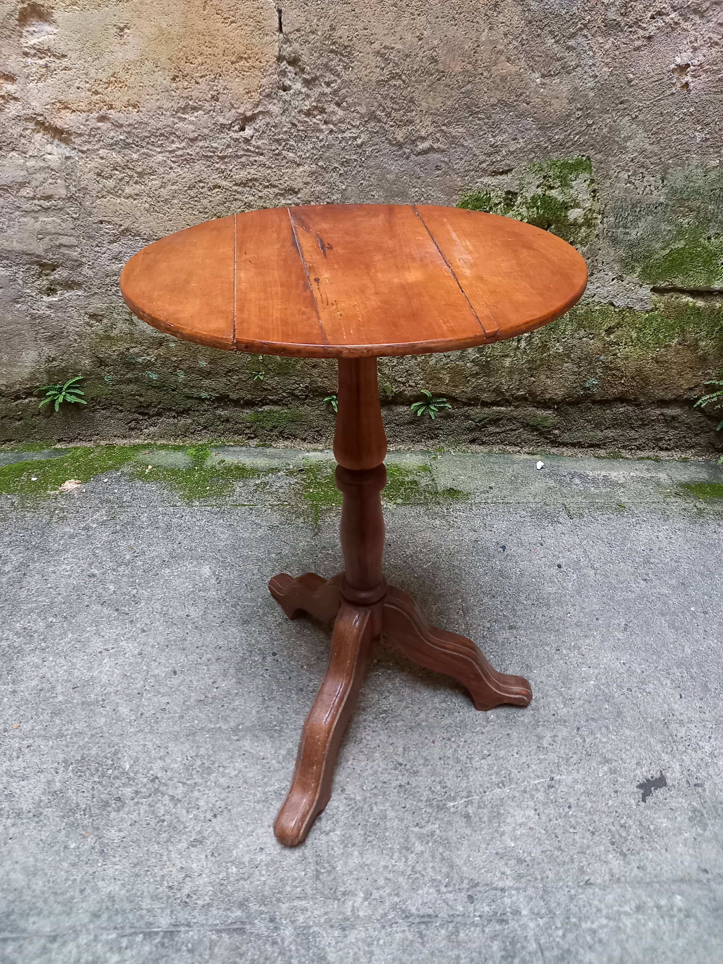 Old wooden gueridon, three-legged column