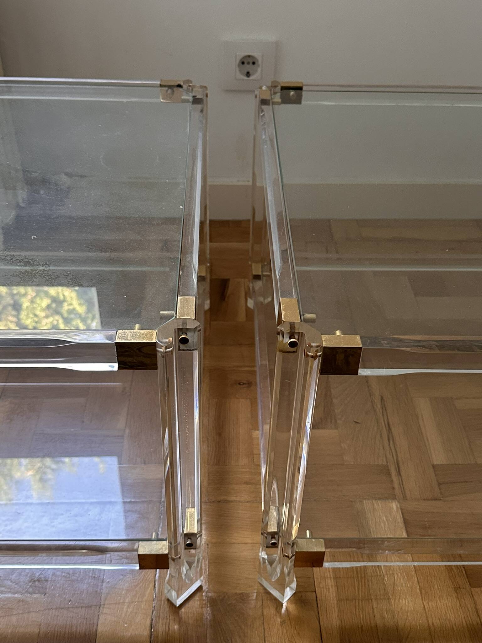2 side tables in plexiglass, glass, and brass.