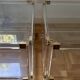 2 side tables in plexiglass, glass, and brass.