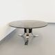 Vintage round coffee table in glass, chromed metal and black metal Space Age style of the 70s
