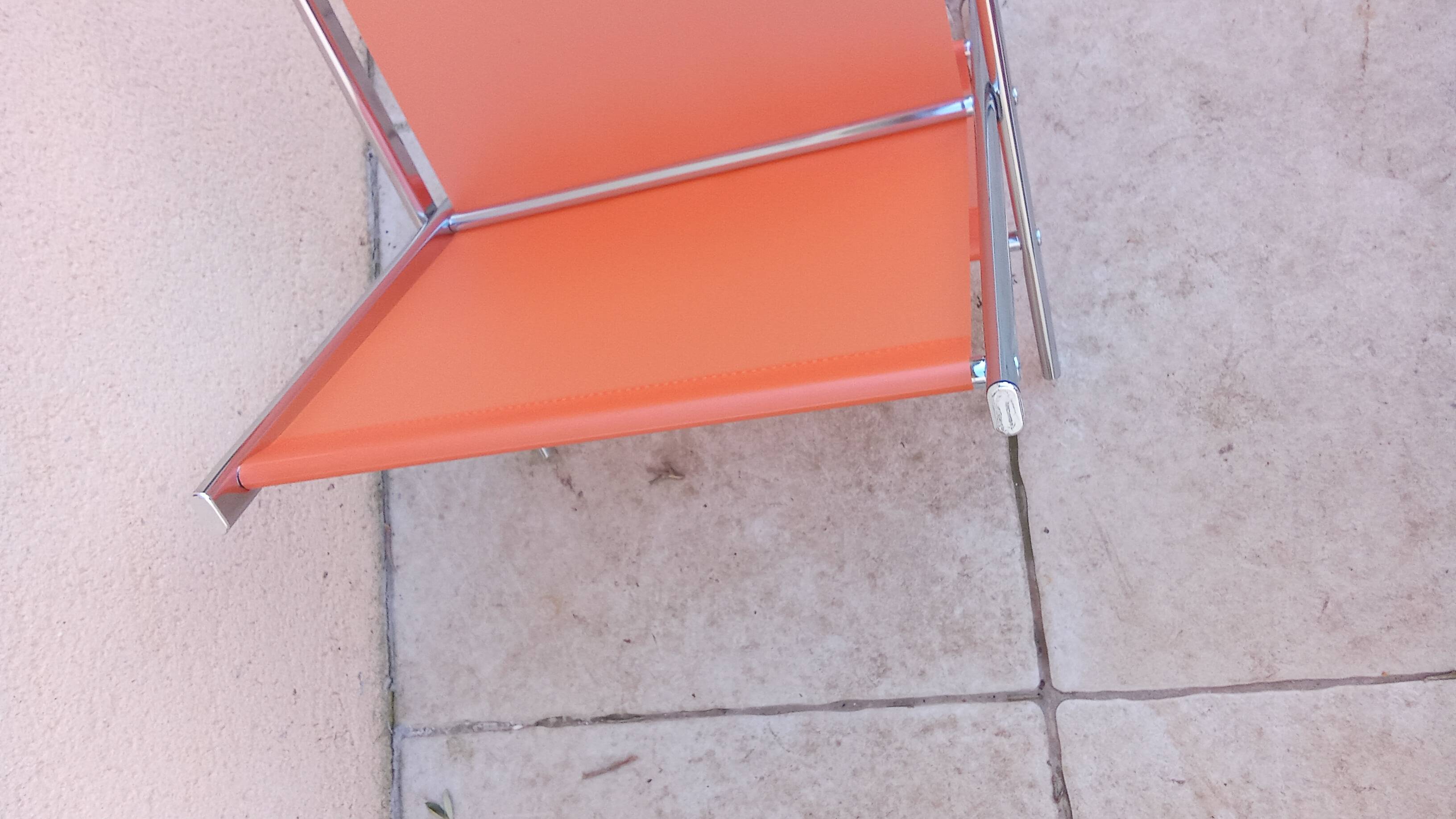 Vintage chrome and orange magazine rack from the 70s and 80s