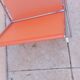 Vintage chrome and orange magazine rack from the 70s and 80s