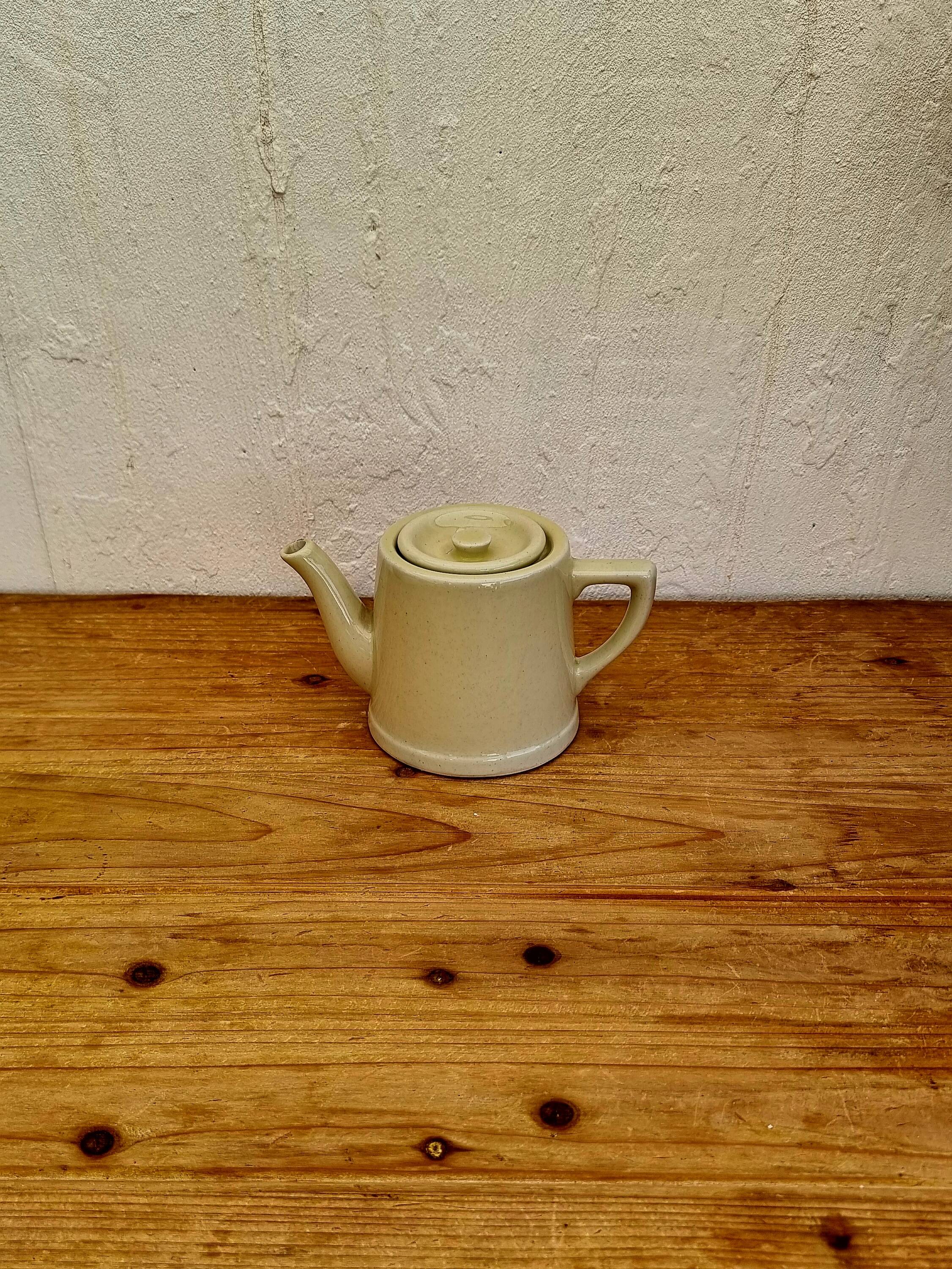Vintage pastel yellow teapot
