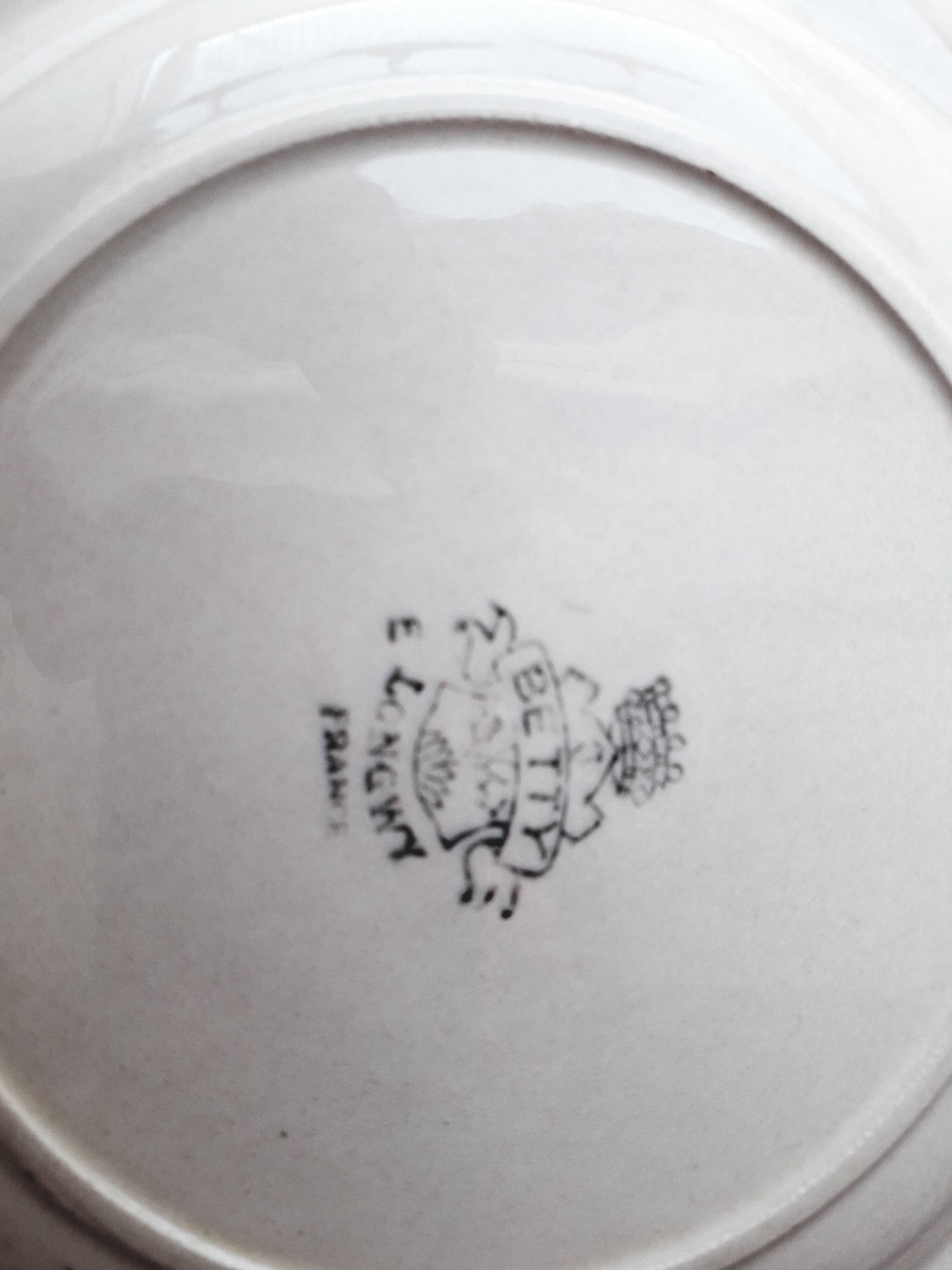 Set of 7 Betty Longwy model plates with floral decoration