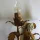 Pair of gold wall sconces with porcelain flowers