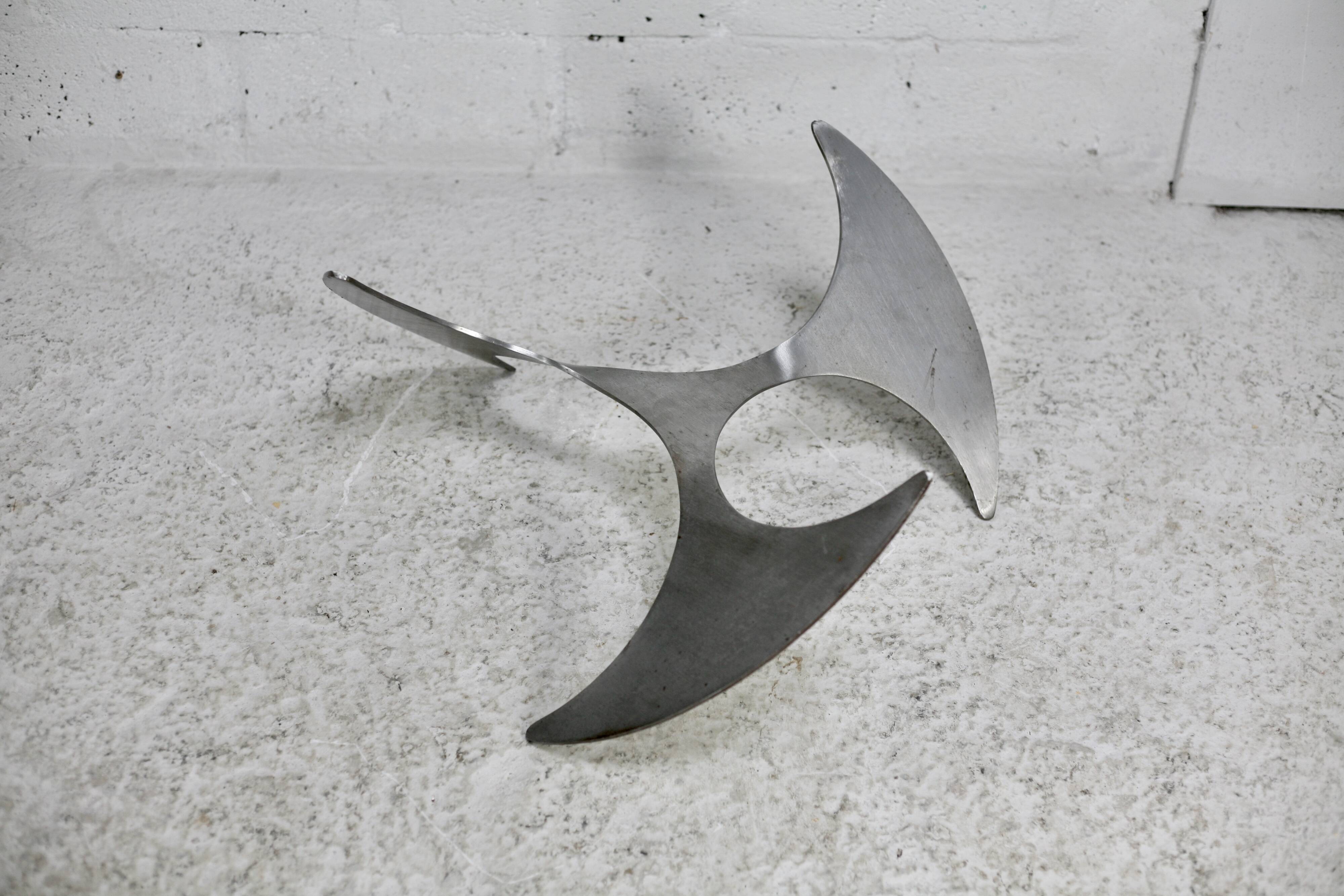 "space age" coffee table. Steel legs, glass slab. Circa 1970